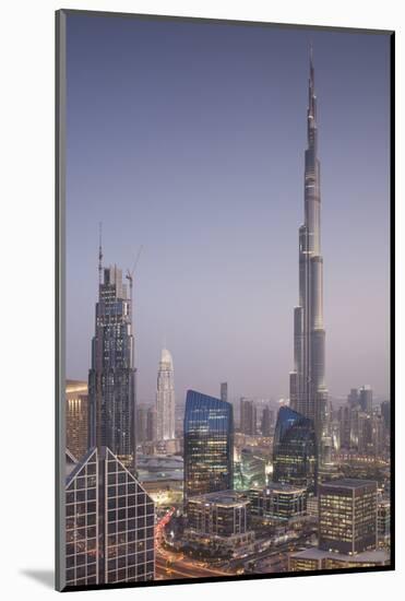 UAE, Downtown Dubai. Cityscape with Burj Khalifa at night.-Walter Bibikow-Mounted Photographic Print