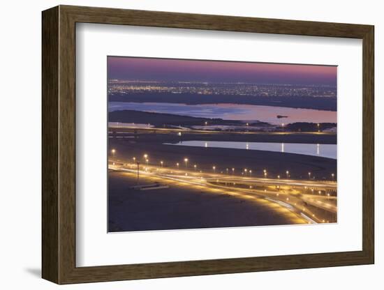 UAE, Downtown Dubai. Elevated desert and highway view.-Walter Bibikow-Framed Photographic Print