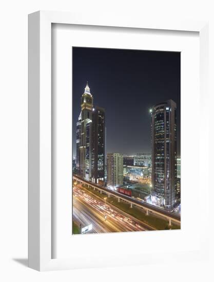 UAE, Downtown Dubai. High-rise buildings along Sheikh Zayed Road.-Walter Bibikow-Framed Photographic Print