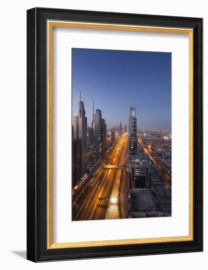 UAE, Downtown Dubai. High-rise buildings along Sheikh Zayed Road.-Walter Bibikow-Framed Photographic Print