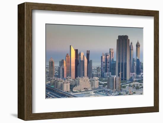 UAE, Downtown Dubai. Skyscrapers on Sheikh Zayed Road from downtown-Walter Bibikow-Framed Photographic Print