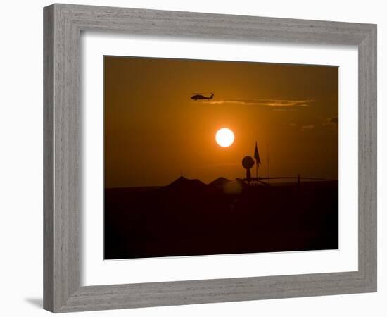 UH-60 Blackhawk Flies over Camp Speicher Airfield at Sunset-Stocktrek Images-Framed Photographic Print