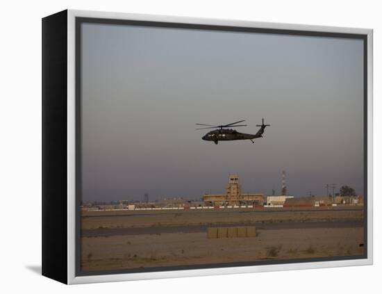 UH-60 Blackhawk Helicopter Flies Past the Tower on Camp Speicher-Stocktrek Images-Framed Premier Image Canvas