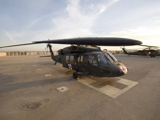 A UH-60 Blackhawk Medivac helicopter sits on the flight 