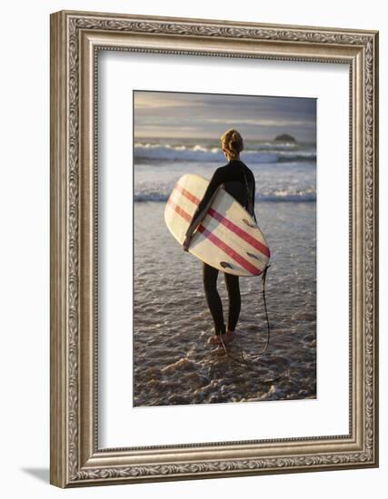 Uk, Cornwall, Polzeath. a Woman Looks Out to See, Preparing for an Evening Surf. Mr-Niels Van Gijn-Framed Photographic Print