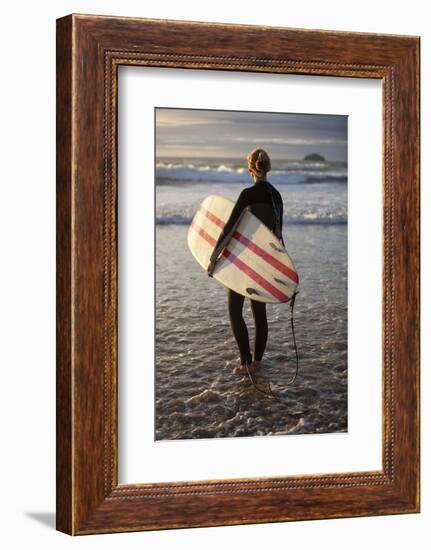 Uk, Cornwall, Polzeath. a Woman Looks Out to See, Preparing for an Evening Surf. Mr-Niels Van Gijn-Framed Photographic Print