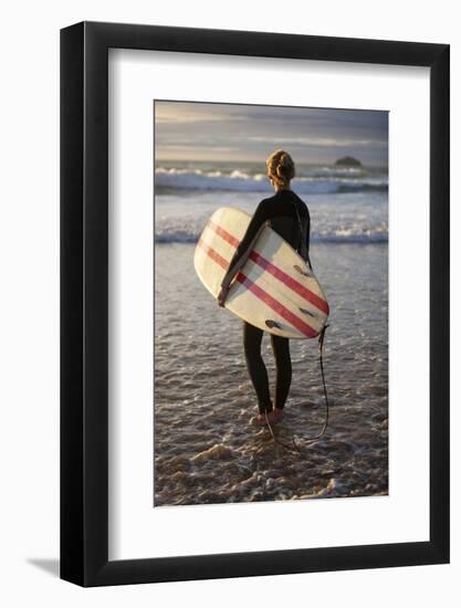 Uk, Cornwall, Polzeath. a Woman Looks Out to See, Preparing for an Evening Surf. Mr-Niels Van Gijn-Framed Photographic Print