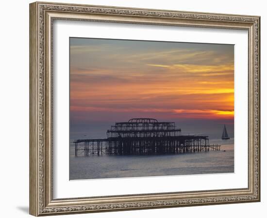 UK, England, Sussex, Brighton, Boat Sailing Past Remains of Brighton West Pier at Sunset-Jane Sweeney-Framed Photographic Print