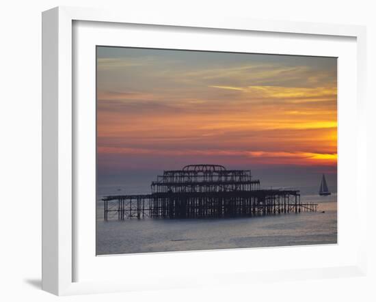 UK, England, Sussex, Brighton, Boat Sailing Past Remains of Brighton West Pier at Sunset-Jane Sweeney-Framed Photographic Print