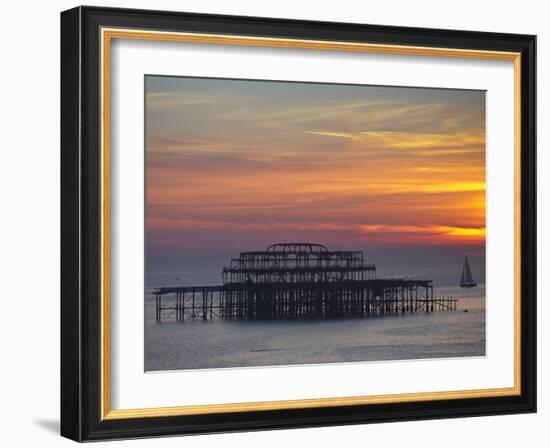 UK, England, Sussex, Brighton, Boat Sailing Past Remains of Brighton West Pier at Sunset-Jane Sweeney-Framed Photographic Print