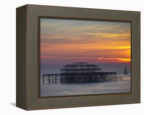 UK, England, Sussex, Brighton, Boat Sailing Past Remains of Brighton West Pier at Sunset-Jane Sweeney-Framed Premier Image Canvas