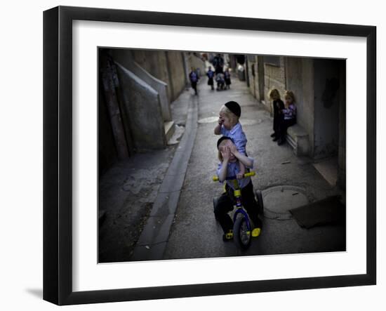 Ultra-Orthodox Jewish Children Cover their Faces as They Play in a Street in Jerusalem-null-Framed Photographic Print