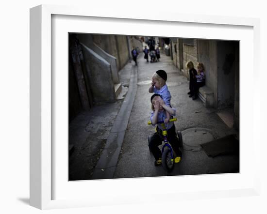 Ultra-Orthodox Jewish Children Cover their Faces as They Play in a Street in Jerusalem-null-Framed Photographic Print