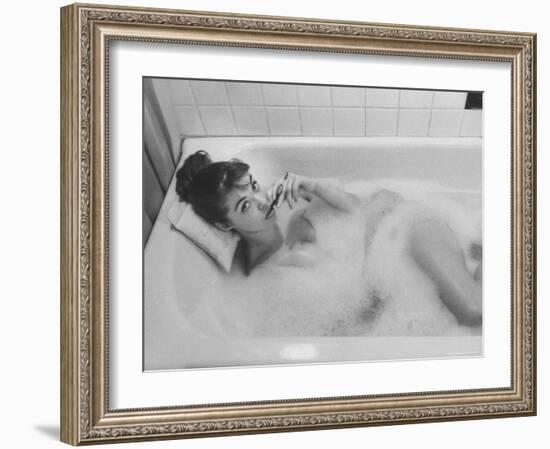 Unexposed Nude Woman in the Bathtub Amid the Bubbles While Smoking a Cigarette-Peter Stackpole-Framed Photographic Print