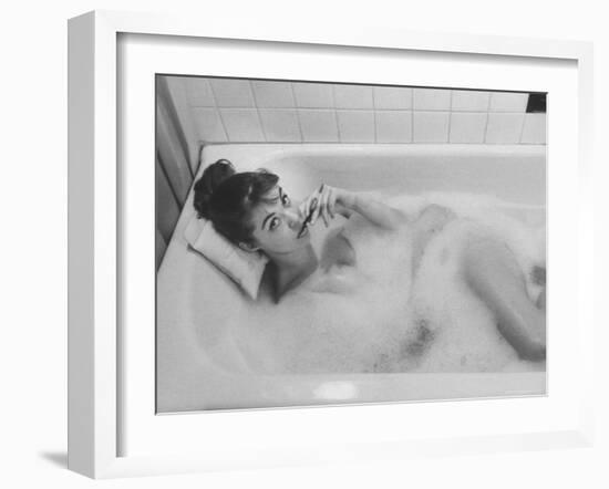 Unexposed Nude Woman in the Bathtub Amid the Bubbles While Smoking a Cigarette-Peter Stackpole-Framed Photographic Print