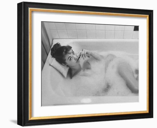 Unexposed Nude Woman in the Bathtub Amid the Bubbles While Smoking a Cigarette-Peter Stackpole-Framed Photographic Print