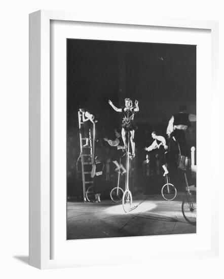 Unicyclists Performering at the Circus-null-Framed Photographic Print