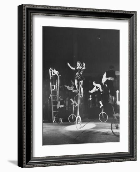 Unicyclists Performering at the Circus-null-Framed Photographic Print