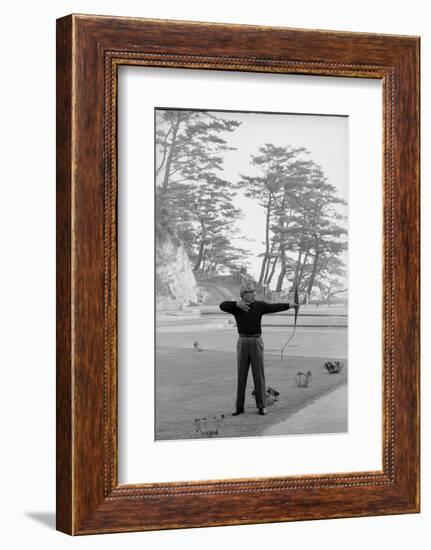 Unidentified Honda Worker in Tokyo Shooting Arrow, 1967-Takeyoshi Tanuma-Framed Photographic Print