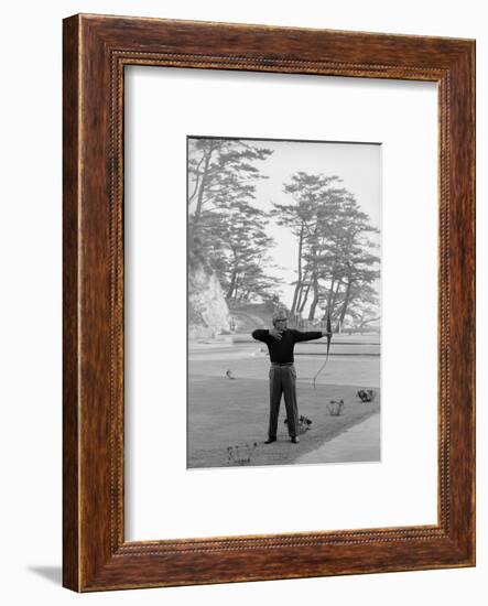 Unidentified Honda Worker in Tokyo Shooting Arrow, 1967-Takeyoshi Tanuma-Framed Photographic Print