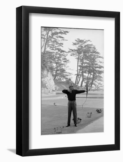 Unidentified Honda Worker in Tokyo Shooting Arrow, 1967-Takeyoshi Tanuma-Framed Photographic Print