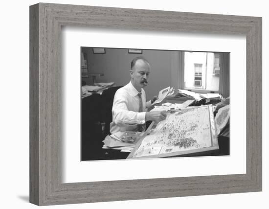 Unidentified Man Pinning a Us Map with Political Religious Bias Statistics, 1960-Walter Sanders-Framed Photographic Print