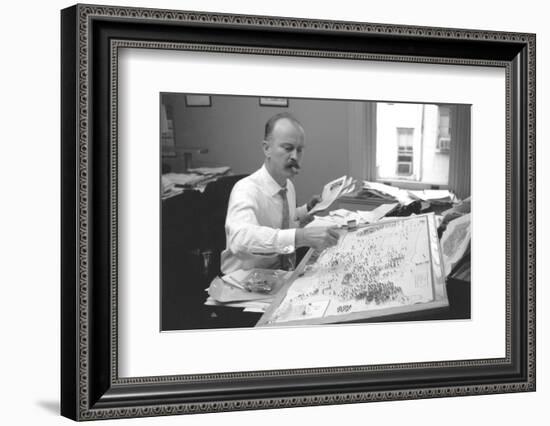 Unidentified Man Pinning a Us Map with Political Religious Bias Statistics, 1960-Walter Sanders-Framed Photographic Print