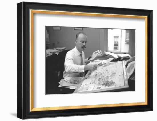 Unidentified Man Pinning a Us Map with Political Religious Bias Statistics, 1960-Walter Sanders-Framed Photographic Print