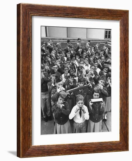 Uniformed Children Who Are Members of Levittown Harmonica Band Playing Harmonicas-Peter Stackpole-Framed Photographic Print