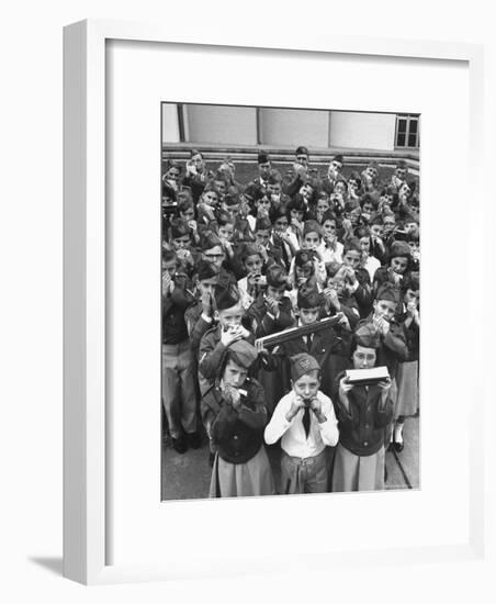 Uniformed Children Who Are Members of Levittown Harmonica Band Playing Harmonicas-Peter Stackpole-Framed Photographic Print