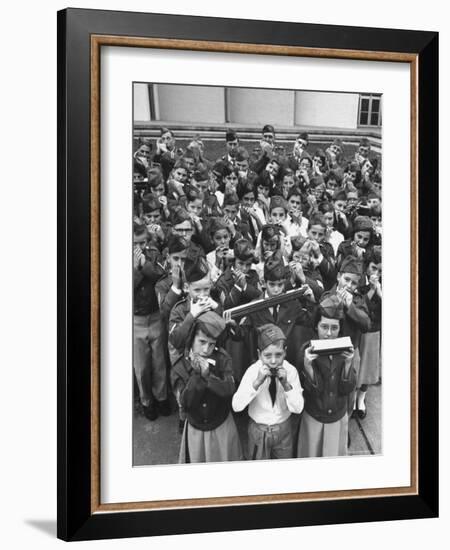 Uniformed Children Who Are Members of Levittown Harmonica Band Playing Harmonicas-Peter Stackpole-Framed Photographic Print