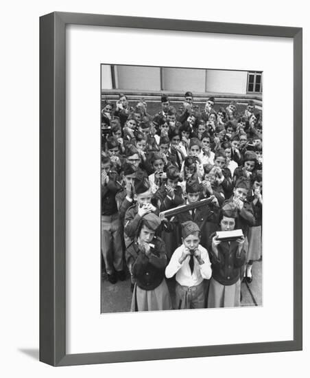 Uniformed Children Who Are Members of Levittown Harmonica Band Playing Harmonicas-Peter Stackpole-Framed Photographic Print