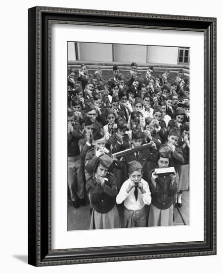 Uniformed Children Who Are Members of Levittown Harmonica Band Playing Harmonicas-Peter Stackpole-Framed Photographic Print