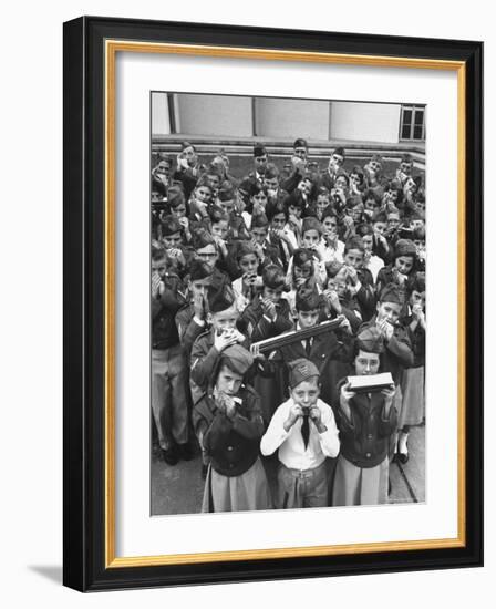 Uniformed Children Who Are Members of Levittown Harmonica Band Playing Harmonicas-Peter Stackpole-Framed Photographic Print