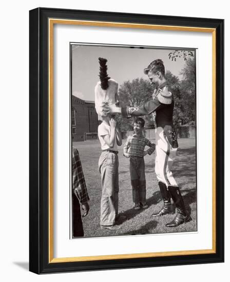 Uniformed Drum Major for the University of Michigan Marching Band on a March Across the Campus Lawn-Alfred Eisenstaedt-Framed Photographic Print