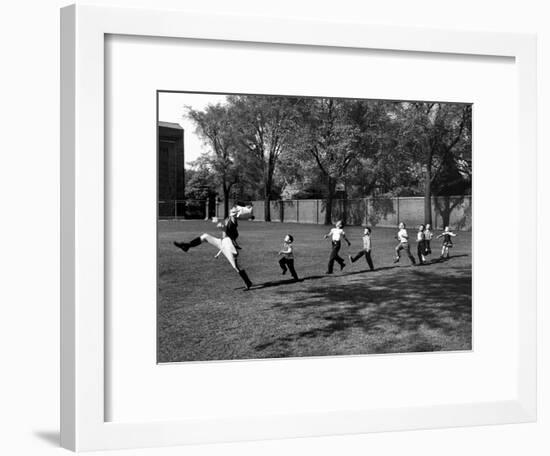 Uniformed Drum Major For University of Michigan Marching Band Practicing His High Kicking Prance-Alfred Eisenstaedt-Framed Photographic Print