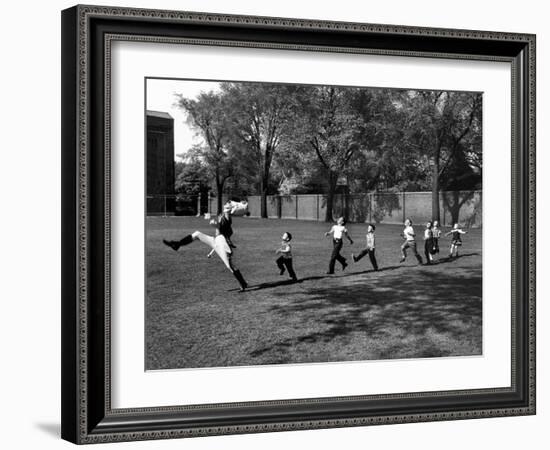 Uniformed Drum Major For University of Michigan Marching Band Practicing His High Kicking Prance-Alfred Eisenstaedt-Framed Photographic Print