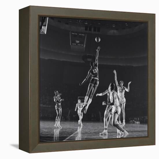 University of Kansas Basketball Player Wilt Chamberlain (C) Playing in a School Game, 1957-George Silk-Framed Premier Image Canvas