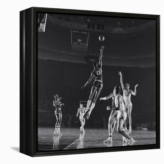 University of Kansas Basketball Player Wilt Chamberlain (C) Playing in a School Game, 1957-George Silk-Framed Premier Image Canvas