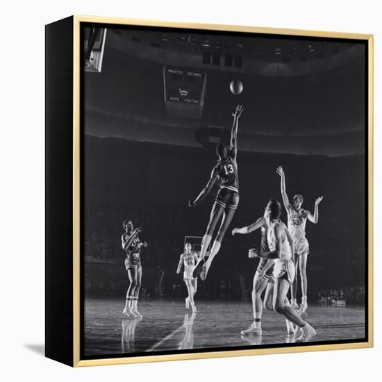 University of Kansas Basketball Player Wilt Chamberlain (C) Playing in a School Game, 1957-George Silk-Framed Premier Image Canvas