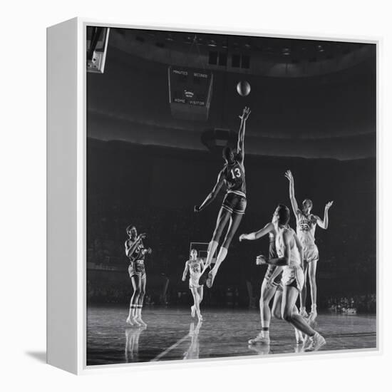 University of Kansas Basketball Player Wilt Chamberlain (C) Playing in a School Game, 1957-George Silk-Framed Premier Image Canvas