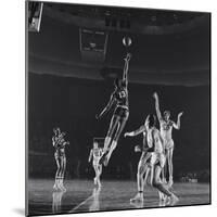 University of Kansas Basketball Player Wilt Chamberlain (C) Playing in a School Game, 1957-George Silk-Mounted Photographic Print