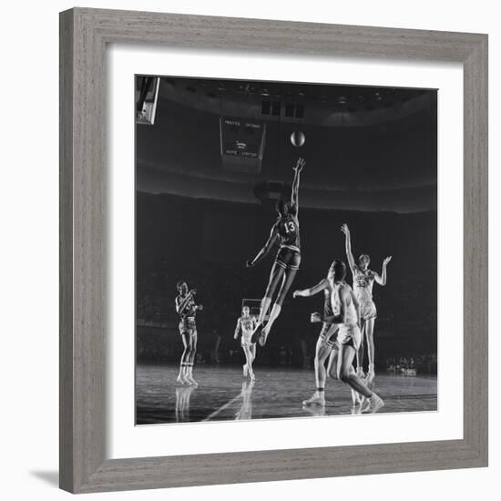 University of Kansas Basketball Player Wilt Chamberlain (C) Playing in a School Game, 1957-George Silk-Framed Photographic Print