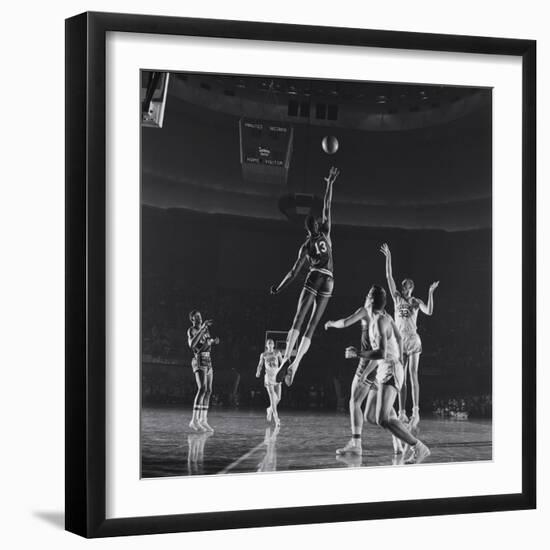 University of Kansas Basketball Player Wilt Chamberlain (C) Playing in a School Game, 1957-George Silk-Framed Photographic Print