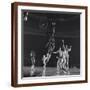 University of Kansas Basketball Player Wilt Chamberlain (C) Playing in a School Game, 1957-George Silk-Framed Photographic Print