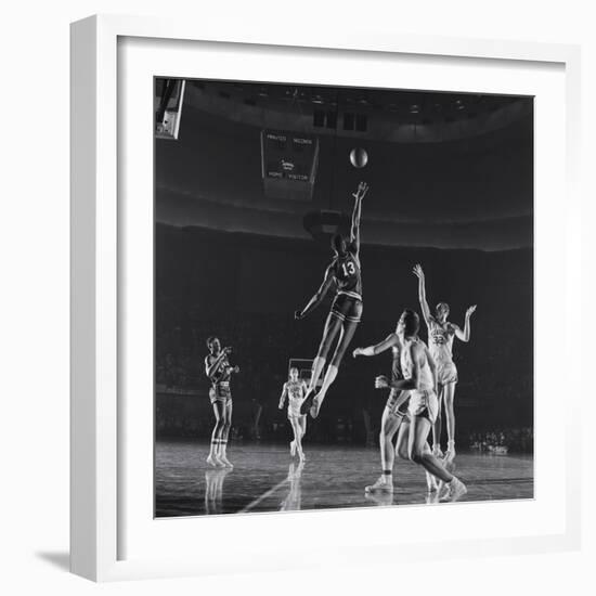 University of Kansas Basketball Player Wilt Chamberlain (C) Playing in a School Game, 1957-George Silk-Framed Photographic Print