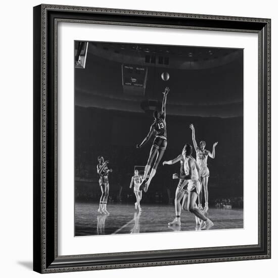 University of Kansas Basketball Player Wilt Chamberlain (C) Playing in a School Game, 1957-George Silk-Framed Photographic Print