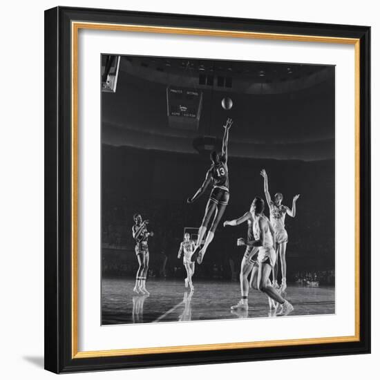 University of Kansas Basketball Player Wilt Chamberlain (C) Playing in a School Game, 1957-George Silk-Framed Photographic Print