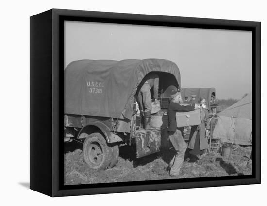 Unloading the goods of a family being moved into the camp for refugees at Forrest City, Arkansas-Walker Evans-Framed Premier Image Canvas