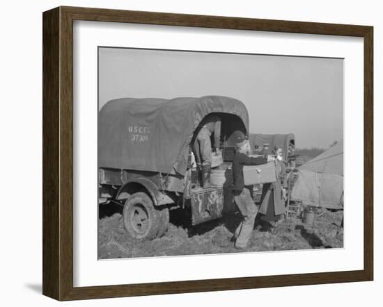 Unloading the goods of a family being moved into the camp for refugees at Forrest City, Arkansas-Walker Evans-Framed Photographic Print